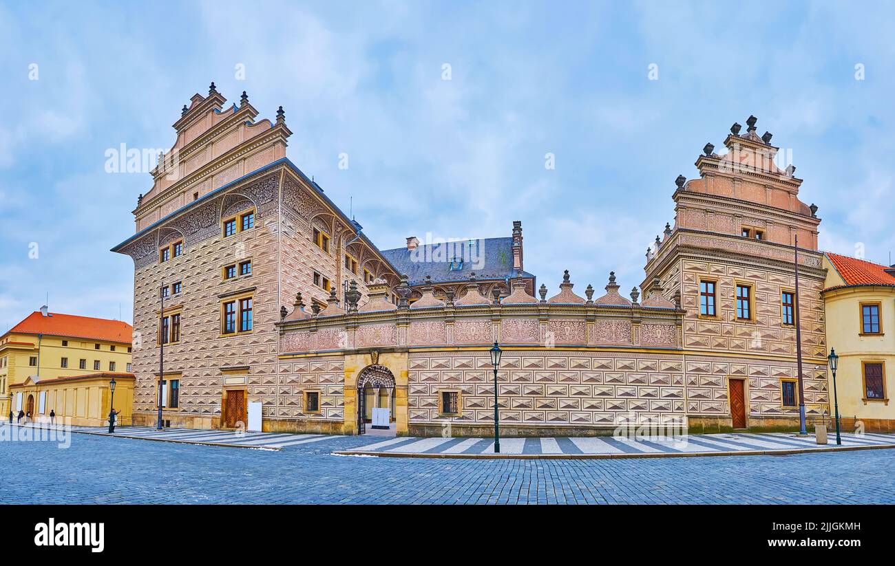 Panorama of the Schwarzenberg Palace facade with carvings, sgraffito decor, gable roofs and arched gate, Castle Square, Hradcany, Prague, Czech Republ Stock Photo