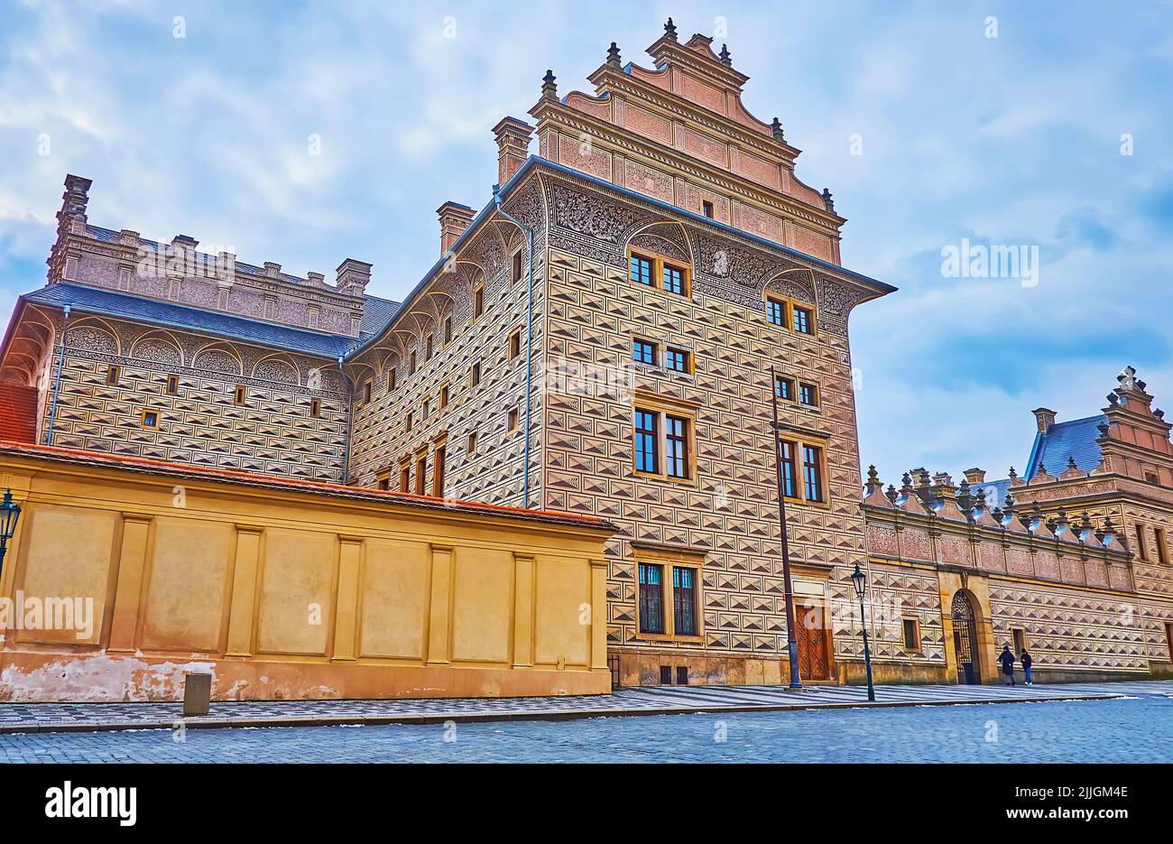 The richly decorated facade of historic Schwarzenberg Palace, covered with traditional Czech sgraffito decor, Castle Square, Hradcany, Prague, Czech R Stock Photo