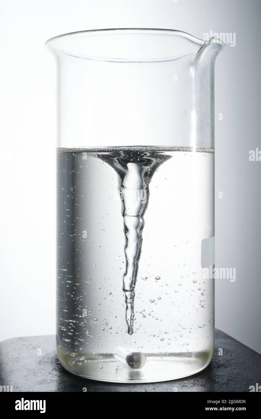 Chemical magnet mixer glass with clean transparent liquid Stock Photo