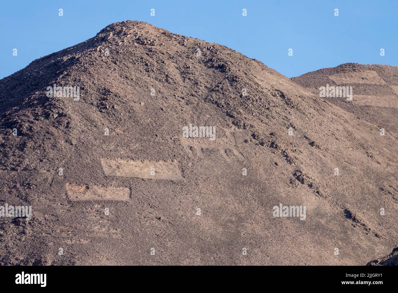 The Cerros Pintados Geoglyphs were made between 700 and 1500 A.D in the Atacama Desert of northern Chile.  They depict stylized figures of people, ani Stock Photo