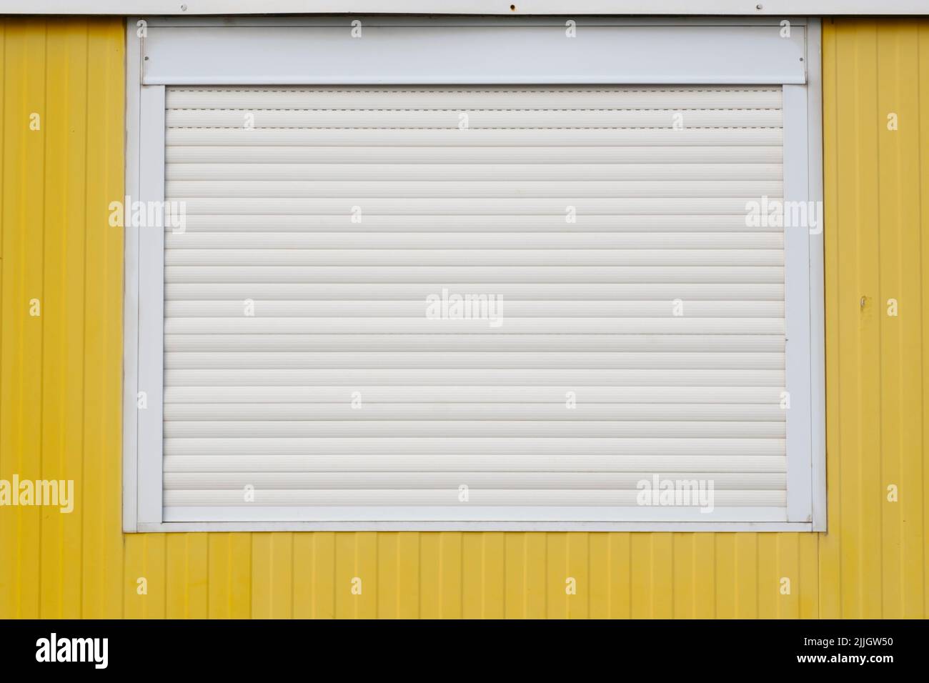 Window with closed roller shutter Stock Photo