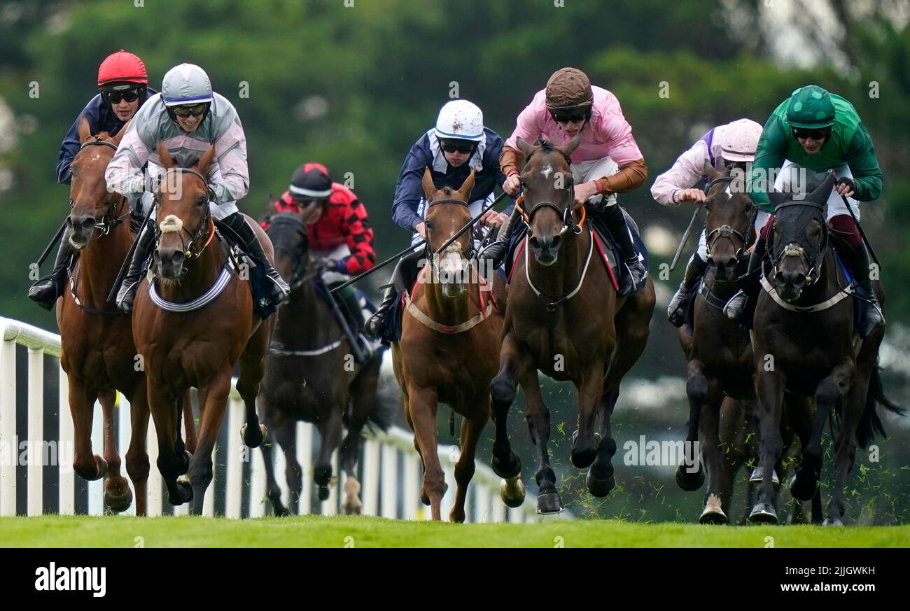 Flaming Moon ridden by Bryan Cooper (left) goes on to win The COLM QUINN BMW Novice Hurdle during day two of the Galway Races Summer Festival 2022 at Galway Racecourse in County Galway, Ireland. Picture date: Tuesday July 26, 2022. Stock Photo