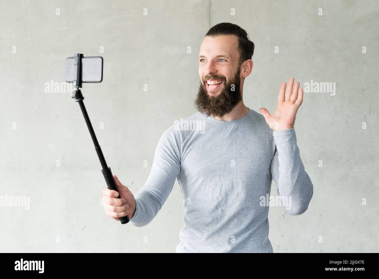 blogger camera man selfie phone monopod video Stock Photo