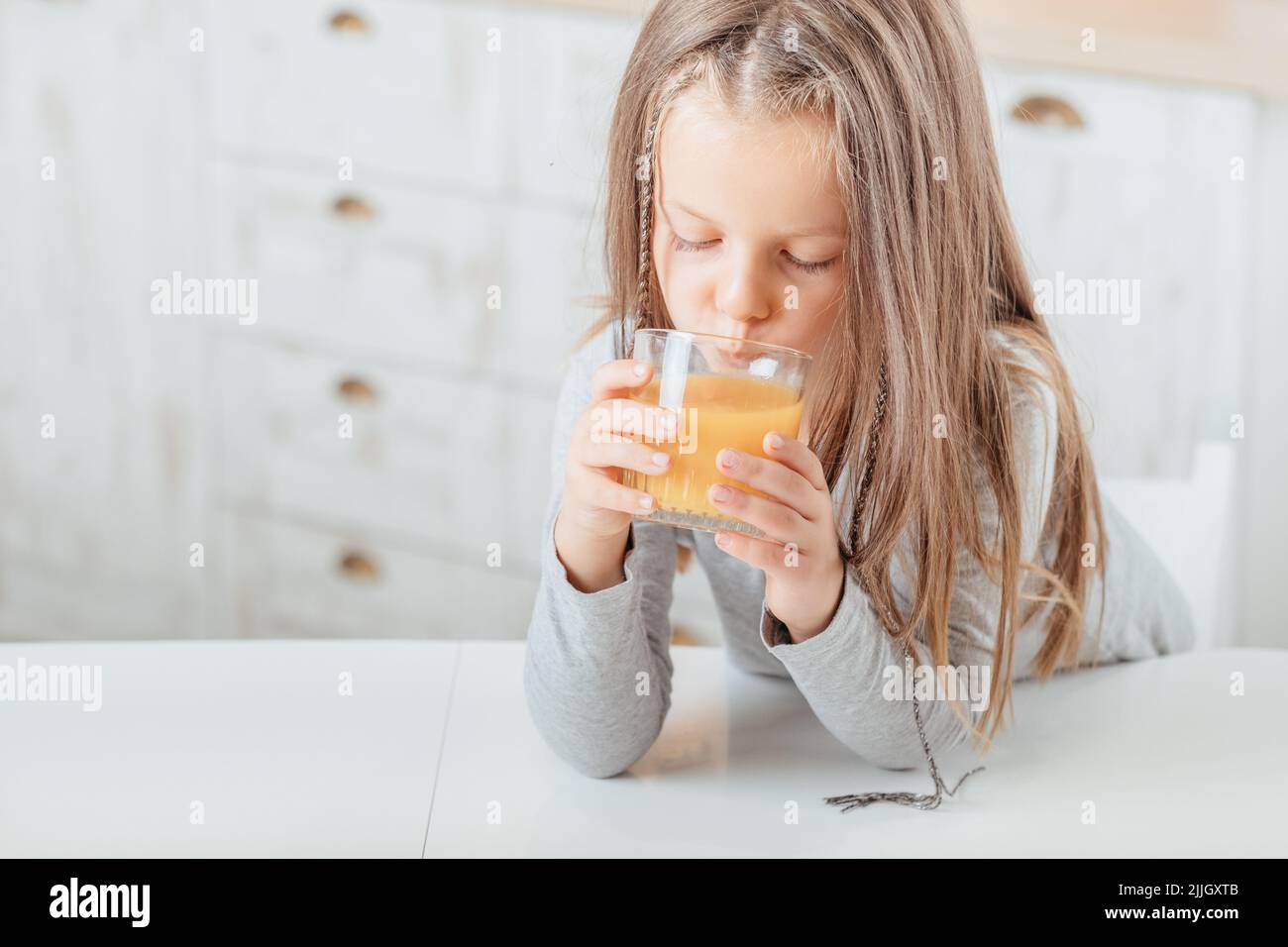 healthy morning beverage girl drinking fruit juice Stock Photo Alamy