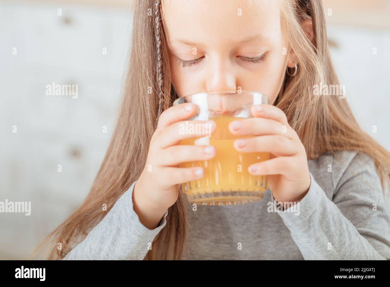 natural fruit nutrition girl drinking orange juice Stock Photo