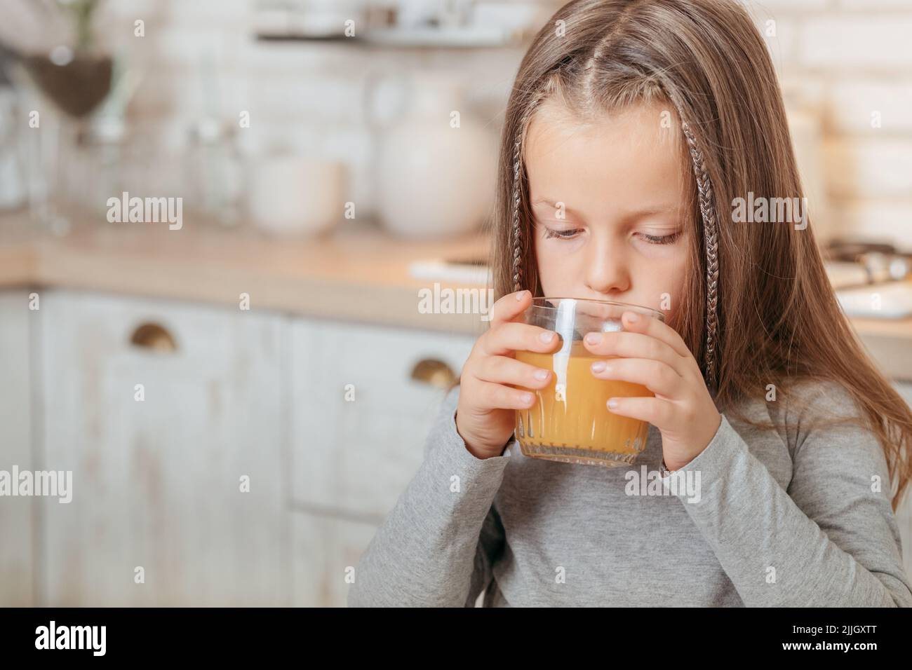 organic fruit nutrition girl drinking orange juice Stock Photo