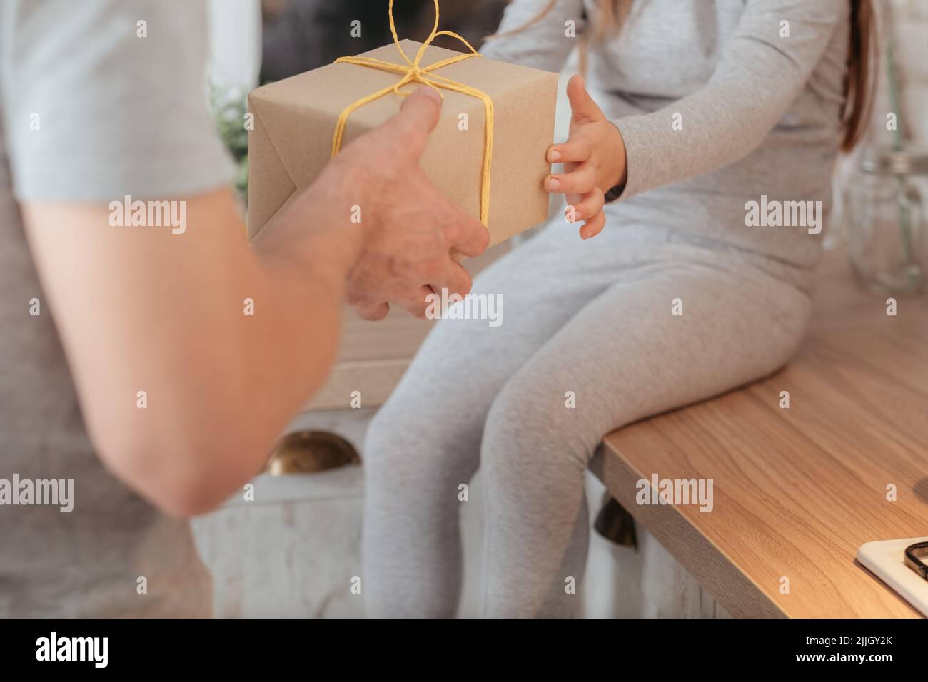 family special occasion girl receiving gift Stock Photo