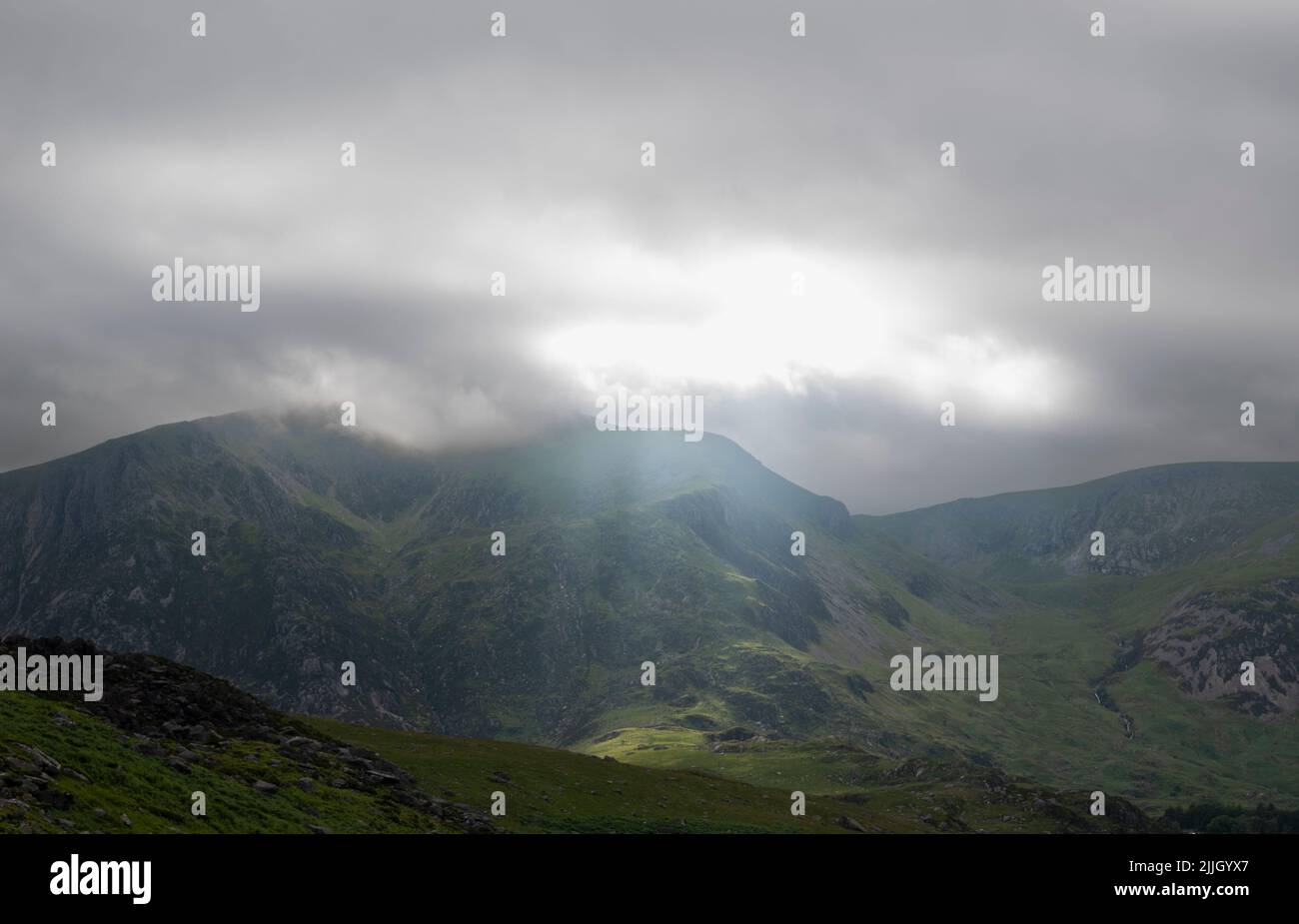 Light Piercing the Clouds over Y Garn Stock Photo