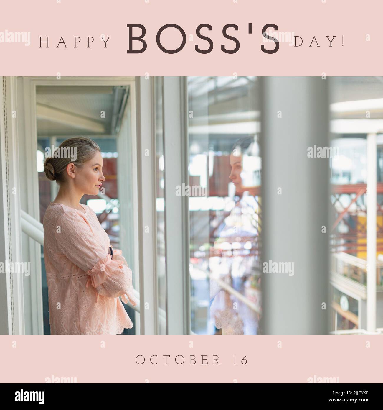 Image of happy boss day over of caucasian woman looking outside window in office Stock Photo