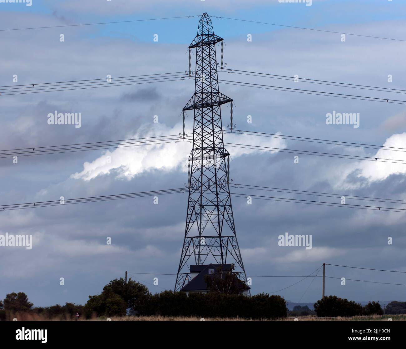 Close-up of a large, High Voltage,  Electricity Pylon, carrying energy generated at Dungeness Atomic Power Station, Stock Photo