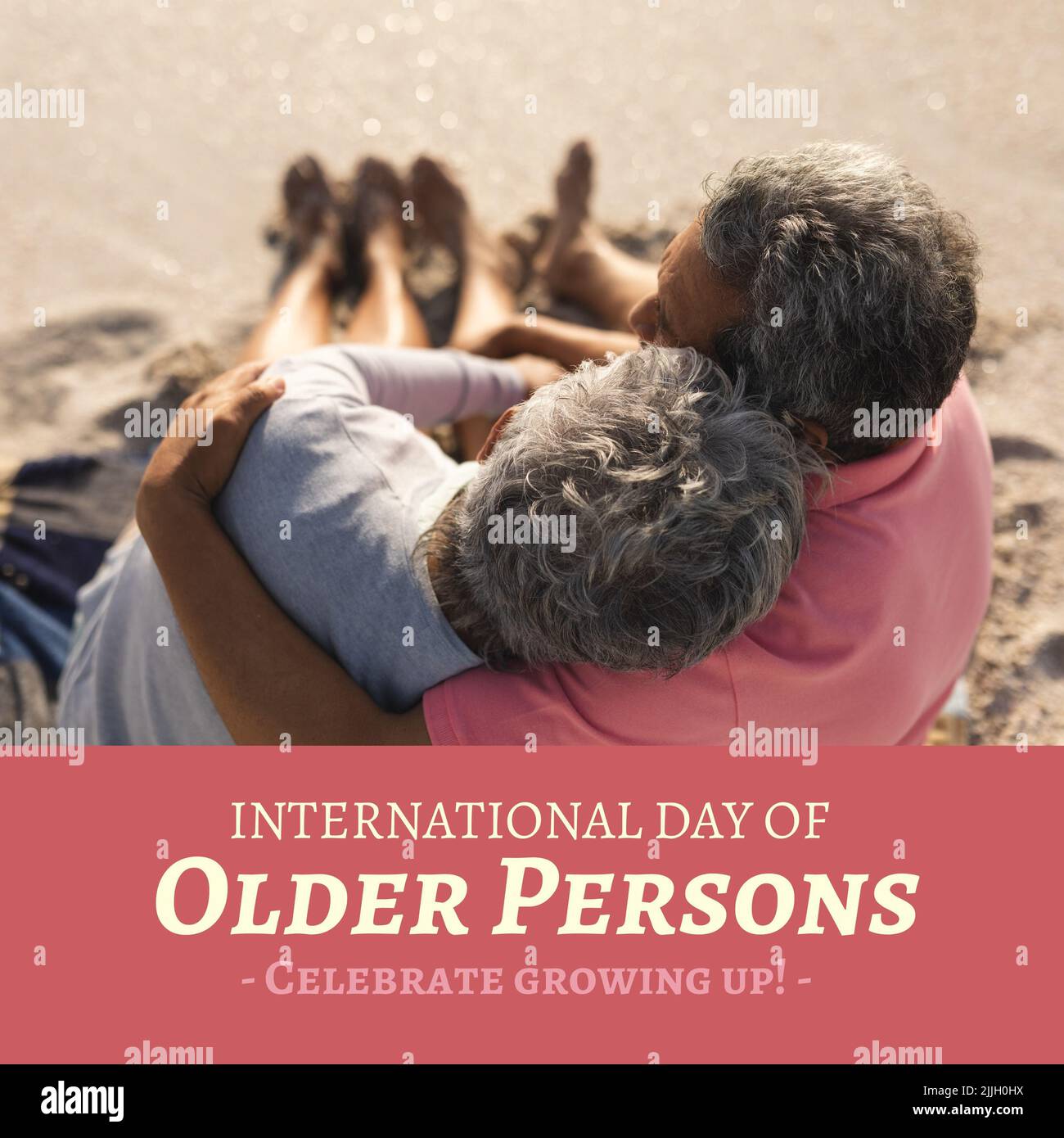 Image of international day of older persons over senior biracial couple embracing on beach Stock Photo