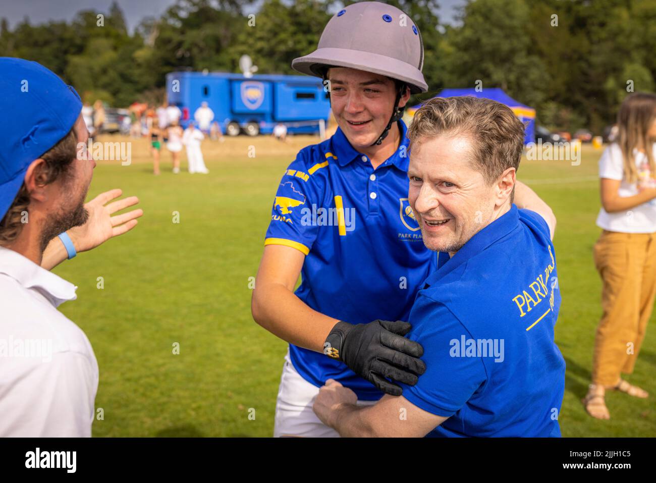Russian banker Andrey Borodin (right) embracing Josh Hyde at the Gold Cup final at Cowdray Park Polo Club where his team, Park Place, beat Dubai in a Stock Photo