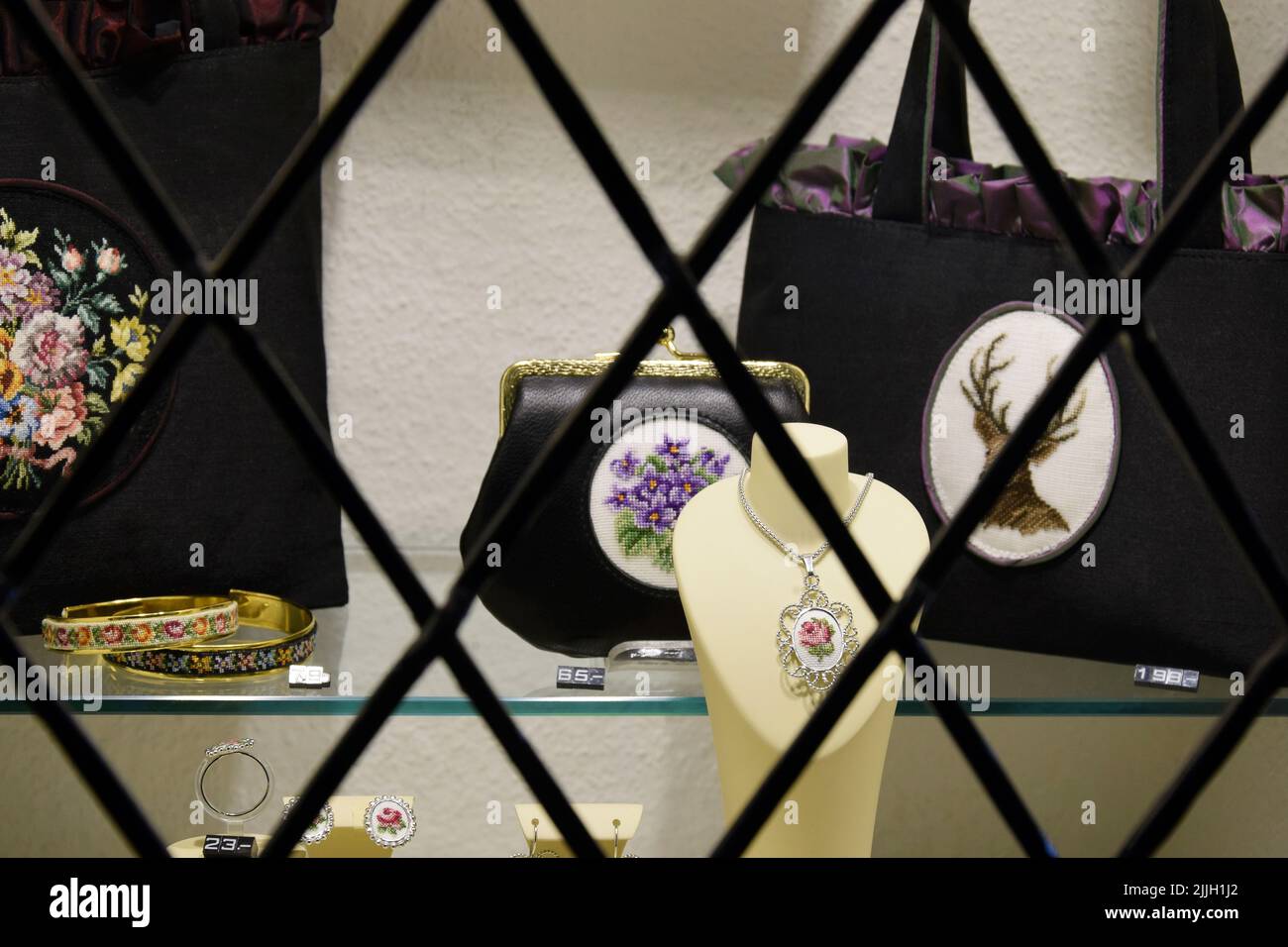Austria, Vienna - may 2019: Shop window with handmade women's accessories, cross-stitch. Close-up. Selective focus. Stock Photo