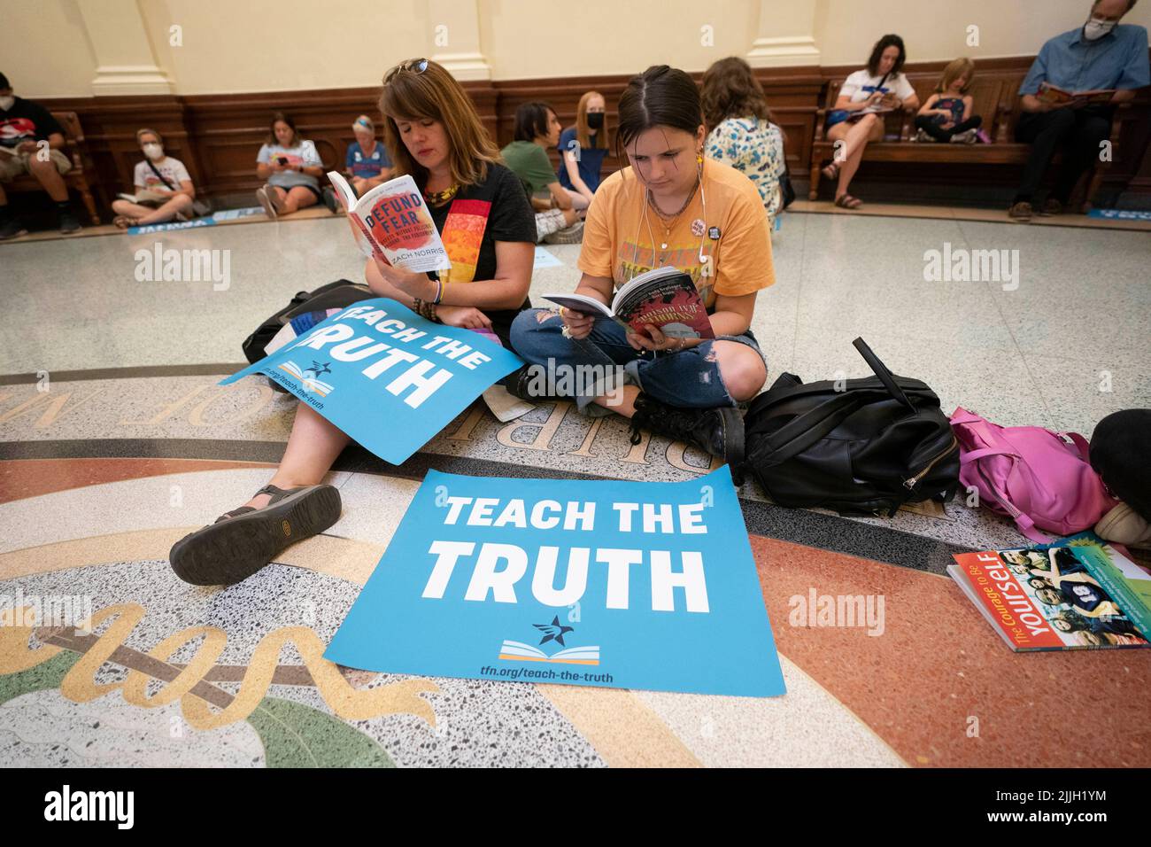 Texas USA, July 26 2022: Rev. ERIN WALTERS, l, and daughter AVE CURRY joins other activists protesting book censorship in public school classrooms and libraries. Protesters sat in the Capitol rotunda and read some of the 850 books listed on a Republican lawmaker's list of 'uncomfortable' titles. Credit: Bob Daemmrich/Alamy Live News Stock Photo