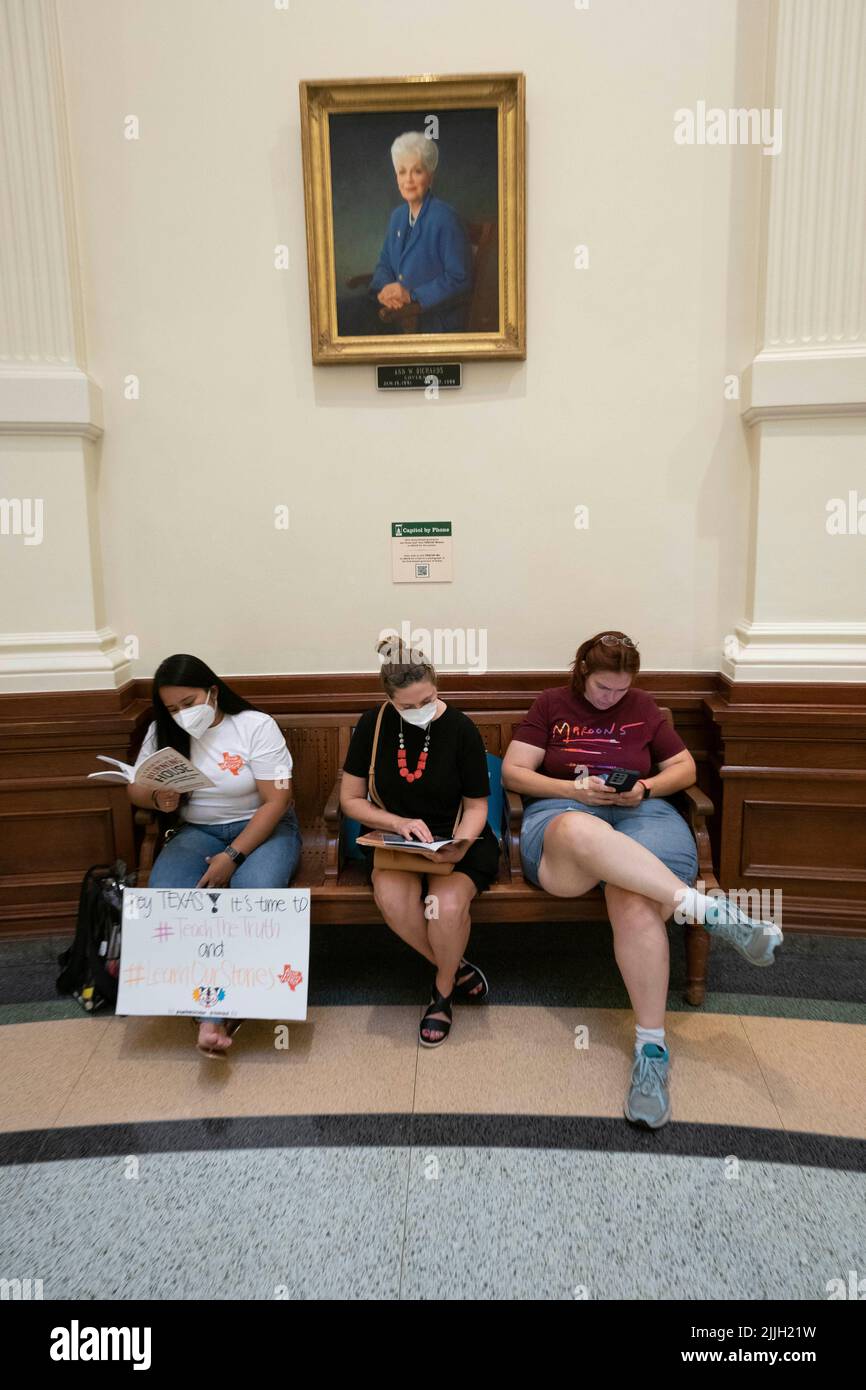 Austin Texas USA, July 26 2022: Activists protesting book censorship in public school classrooms and libraries sit in the Capitol rotunda and read some of the 850 books listed on a Republican lawmaker's list of 'uncomfortable' titles. The women are sitting below a portrait of former Gov. Ann Richards. Credit: Bob Daemmrich/Alamy Live News Stock Photo