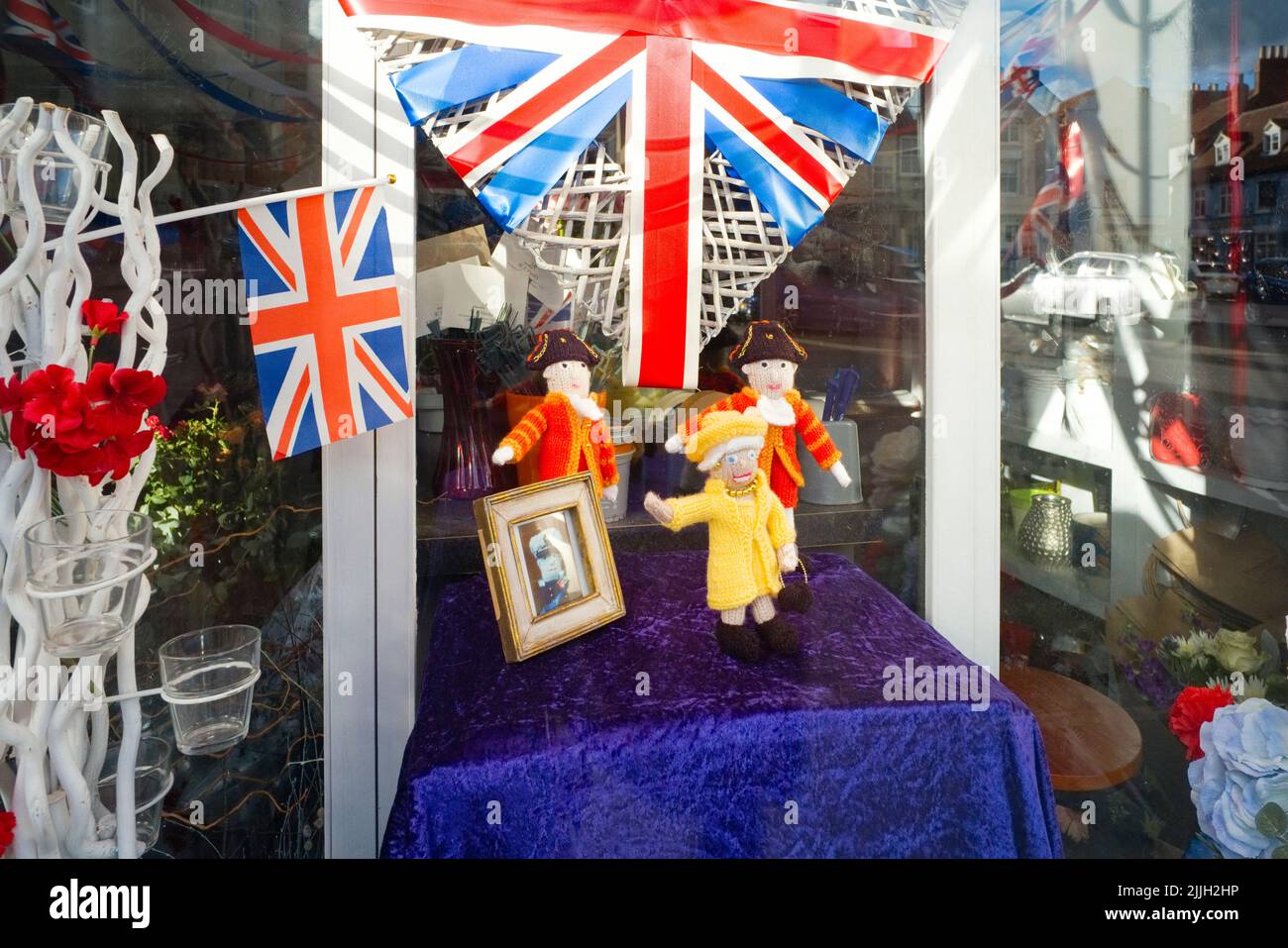 Knitted tableau of the Queen in a window at Malton during the Jubilee weekend celebrations Stock Photo