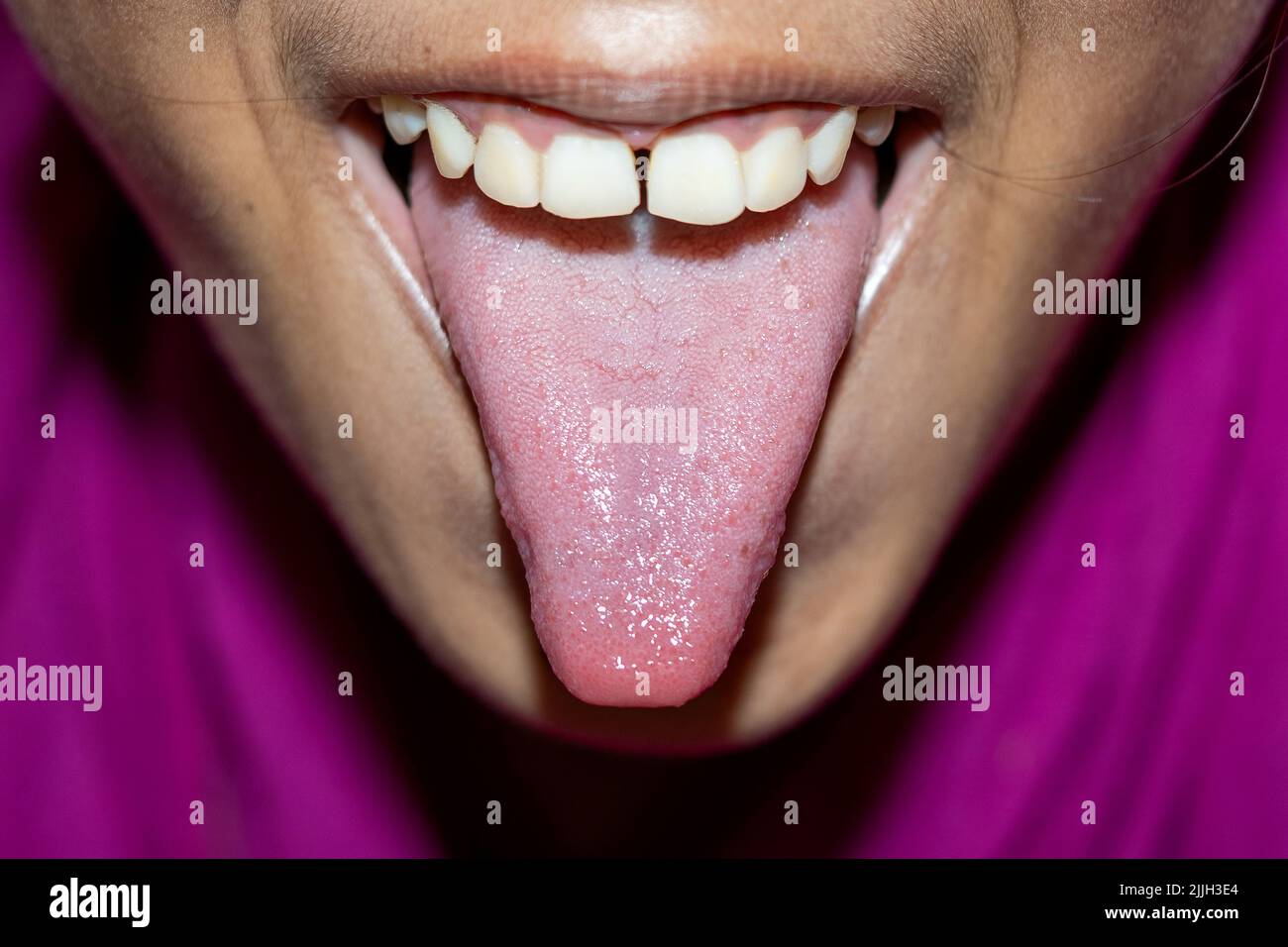 Close up on taste bud on woman tongue Stock Photo