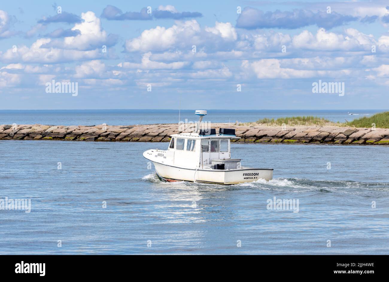 Fishing boat, Freedom leaving Montauk, NY Stock Photo