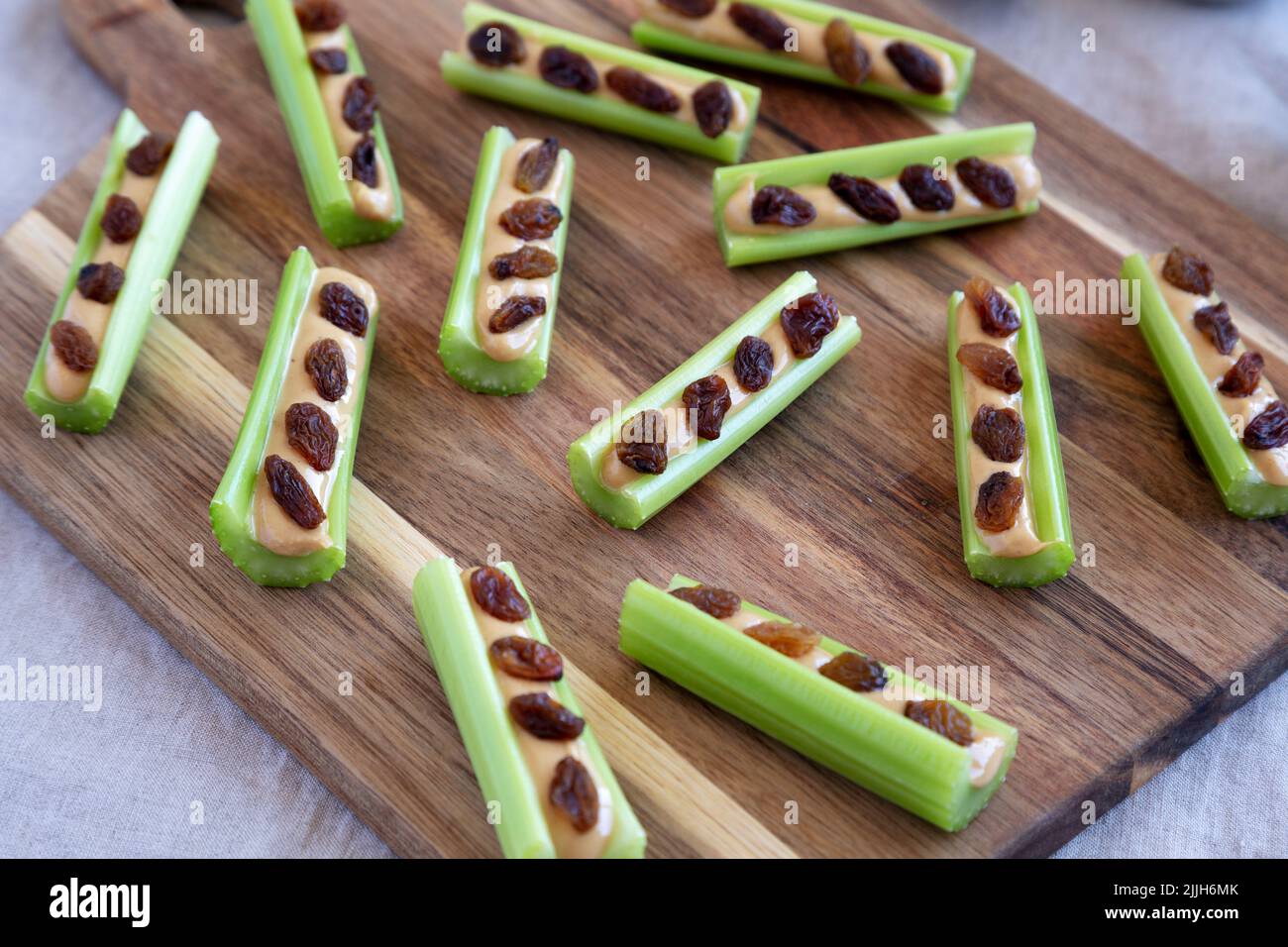 Homemade ants on a log with celery, peanut butter and raisins on a