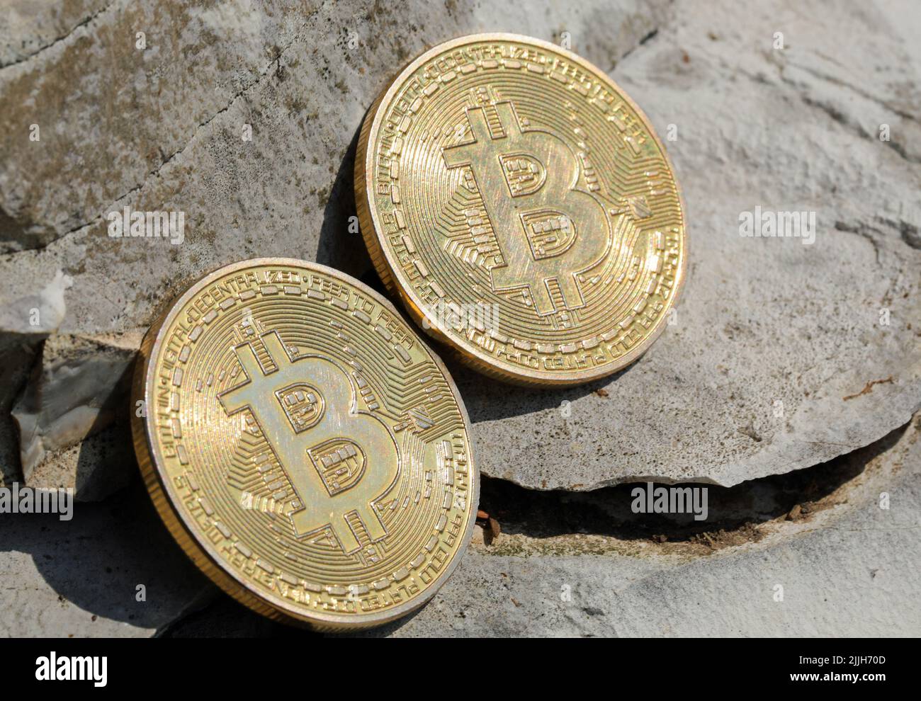 two coins with the capital letter B symbolizing the cryptocurrency BITCOIN  in the middle of the stones of the mine after the discovery of the money  Stock Photo - Alamy