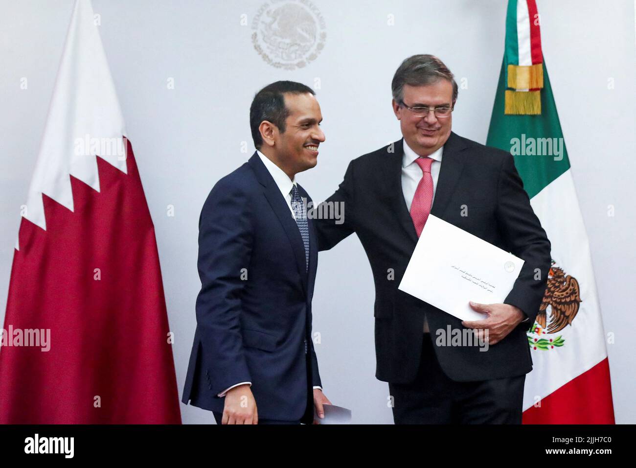 Qatar’s Foreign Minister, Mohammed bin Abdulrahman bin Jassim Al Than, and Mexico’s Foreign Minister, Marcelo Ebrard, smile after they addressed the media at the Foreign Ministry Building (SRE) in Mexico City, Mexico, July 26, 2022. REUTERS/Edgard Garrido Stock Photo