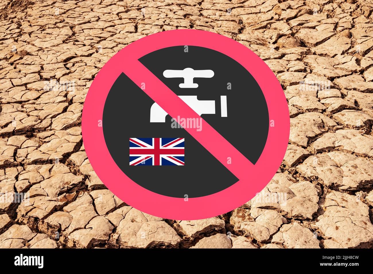 Dry reservoir, lake, cracked earth with hosepipe, water, tap prohibited sign. Global warming, climate crisis, drought... uk Stock Photo
