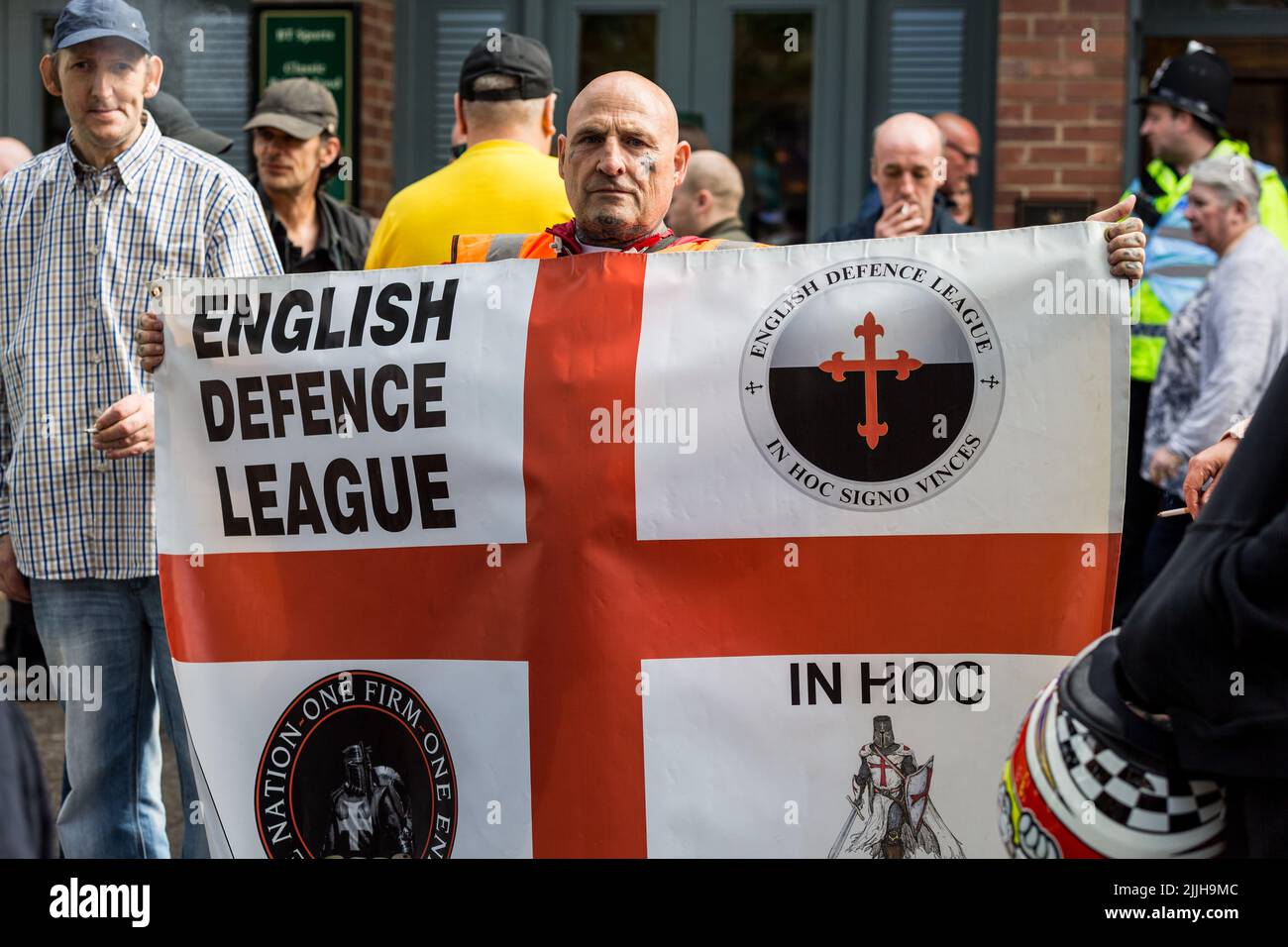 A man holding a flag during the EDL march through Newcastle city Stock