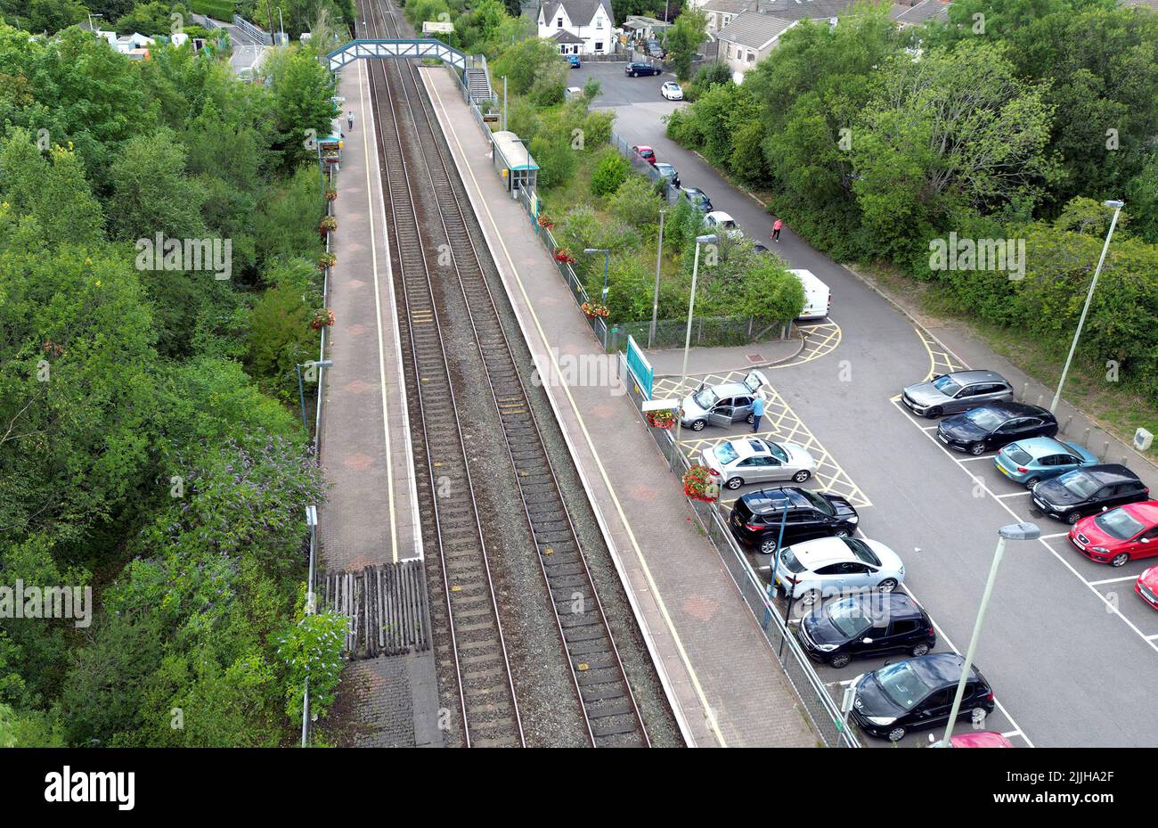 Pontyclun, Wales - July 2022: Aerial view of the railway station and park and ride car park in the village of Pontyclun in South Wales Stock Photo