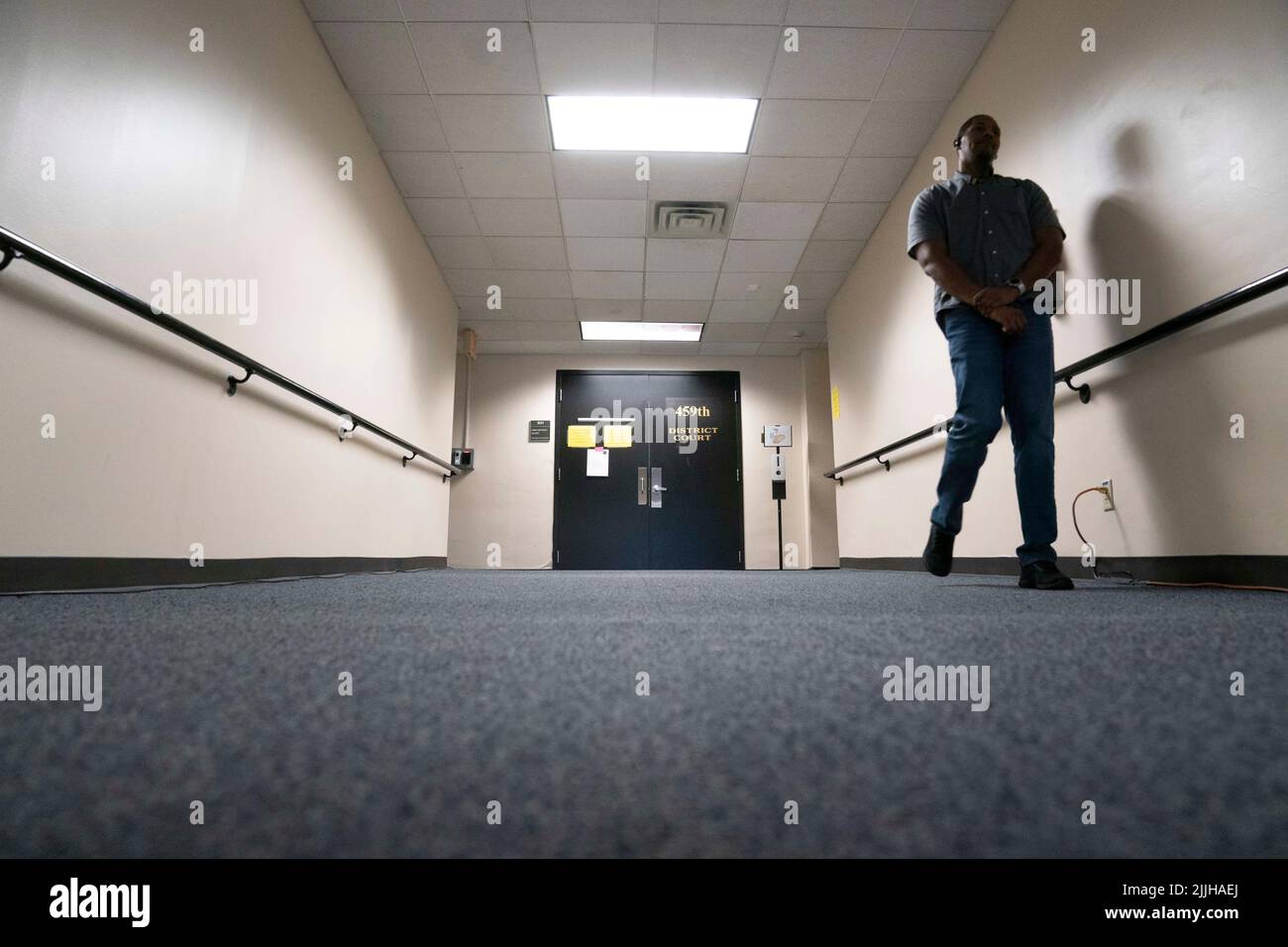 Austin Texas USA, July 26 2022: A lone security guard stands outside the 459th District Courtroom of Judge Maya Guerra Gamble on the first day of InfoWars' Alex Jones (not shown) defamation trail. The case centers on the damages Jones will have to pay victims in the 2012 Sandy Hook school massacre. Credit: Bob Daemmrich/Alamy Live News Stock Photo
