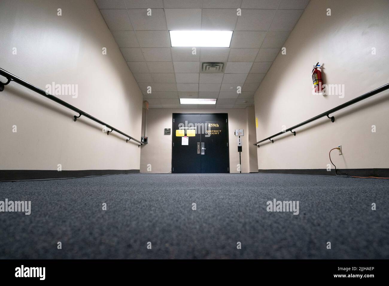 Austin Texas USA, July 26 2022: An empty hallway leads to the 459th District Courtroom of Judge Maya Guerra Gamble on the first day of InfoWars' Alex Jones (not shown) defamation trail. The case centers on the damages Jones will have to pay victims in the 2012 Sandy Hook school massacre. Credit: Bob Daemmrich/Alamy Live News Stock Photo