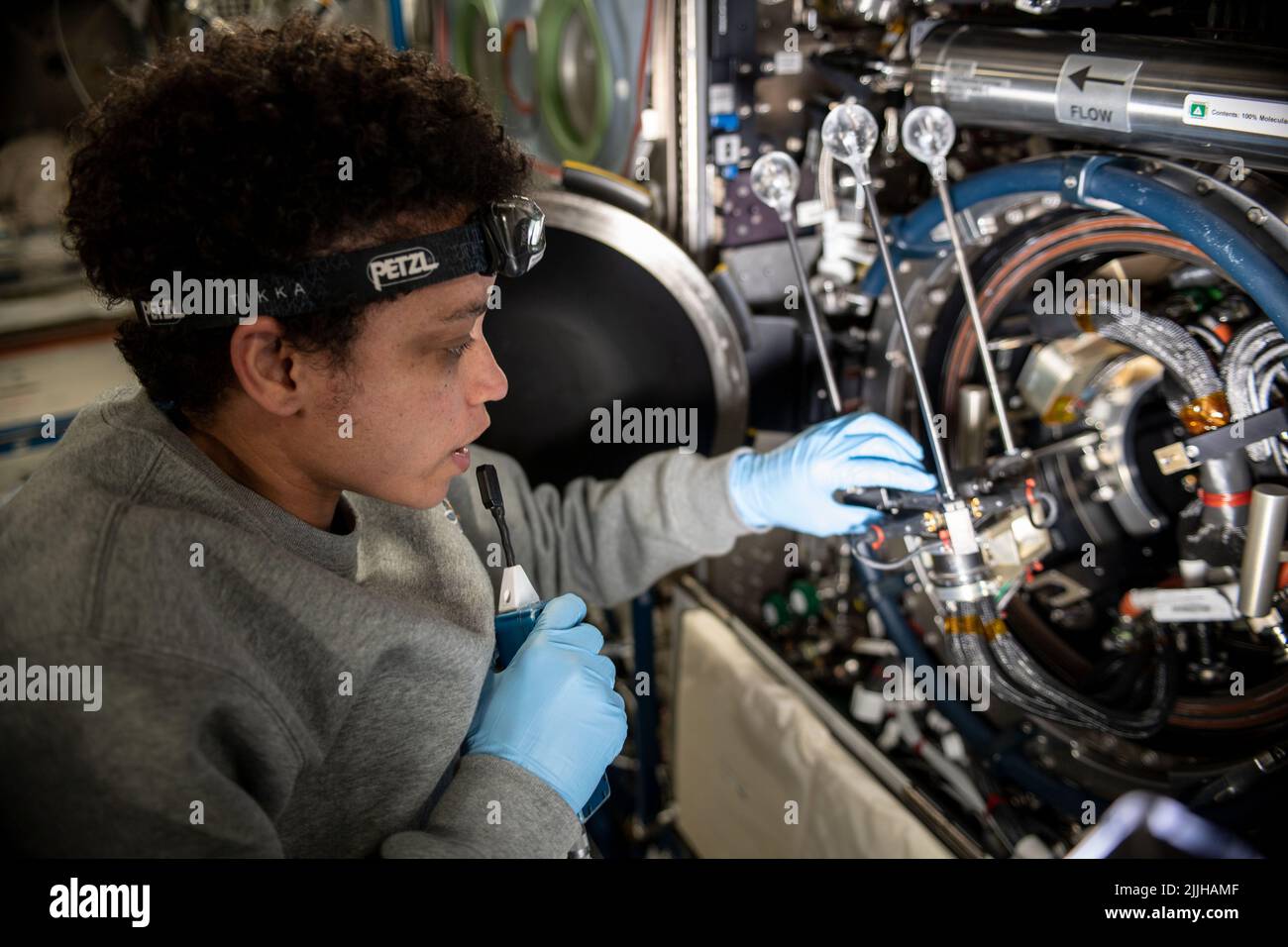 NASA astronaut and Expedition 67 Flight Engineer Jessica Watkins services components that support the Solid Fuel Ignition and Extinction fire safety experiment inside the Combustion Integrated Rack of the Destiny Laboratory Module onboard the International Space Station, June 24, 2022 in Earth Orbit. Stock Photo