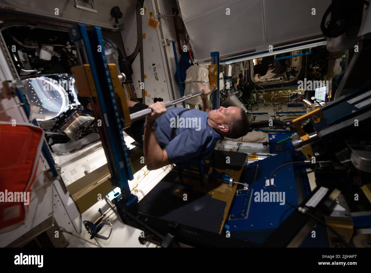 NASA astronaut and Expedition 67 Flight Engineer Bob Hines works out on the Advanced Resistive Exercise Device inside the Tranquility module onboard the International Space Station, July 8, 2022 in Earth Orbit. Stock Photo
