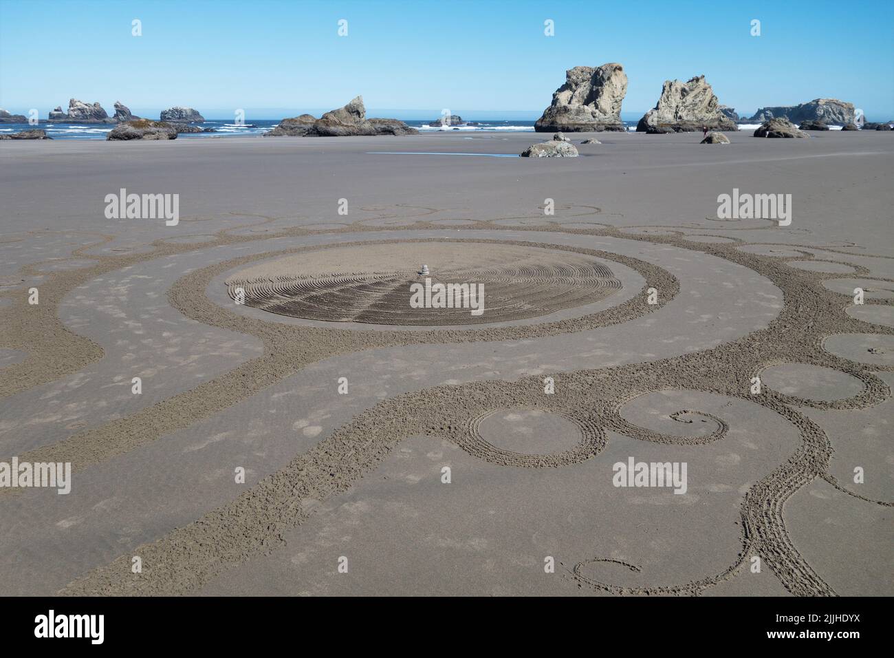 A sand labyrinth created by Denny Dyke and the Circles in the Sand volunteers at Face Rock Beach in Bandon, Oregon. Stock Photo