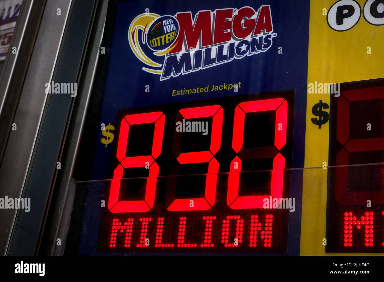 A sign displays the $830 million jackpot total for the Mega Millions lottery drawing at a news stand in New York City, U.S., July 26, 2022.  REUTERS/Brendan McDermid Stock Photo