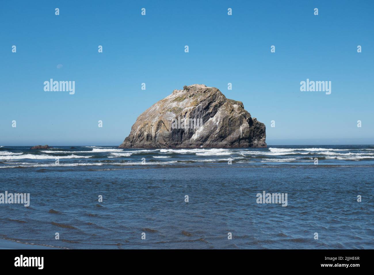 A large rock that looks like a woman's face, at Face Rock Beach in Bandon, Oregon. Stock Photo