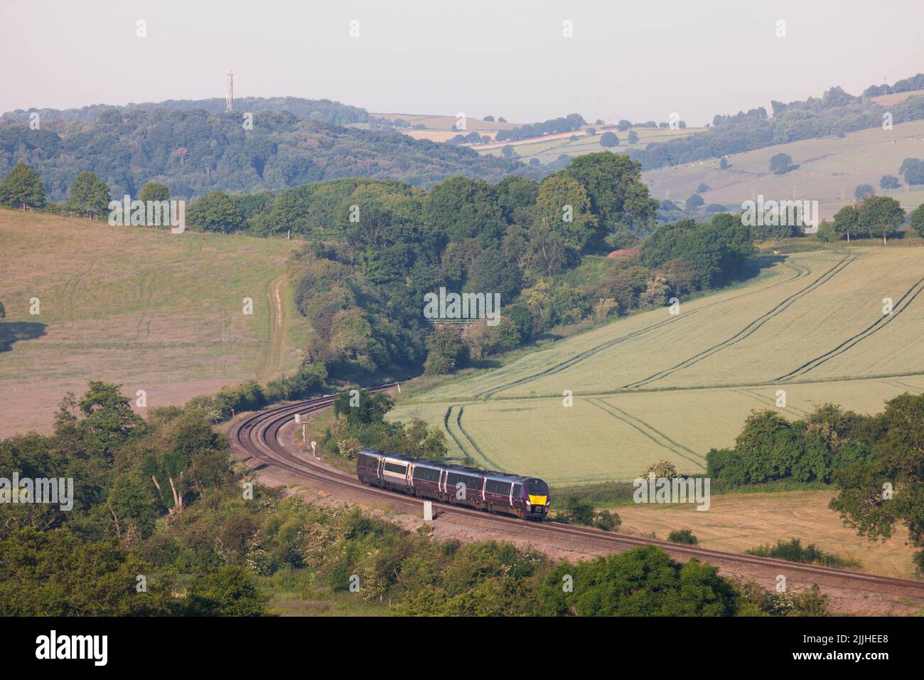 East Midlands railway class 222 meridian train  222104 passing  Wingfield Park Derbyshire in the countryside on the Midland mainline Stock Photo