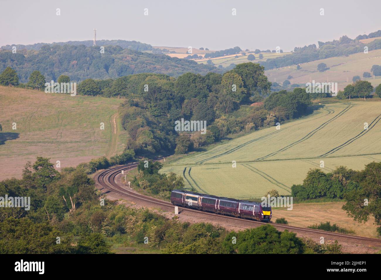 East Midlands railway class 222 meridian train  222104 passing  Wingfield Park Derbyshire in the countryside on the Midland mainline Stock Photo