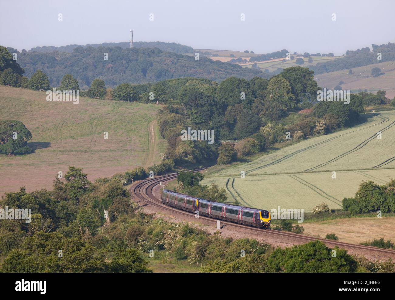 Crosscountry voyager trains passing  Wingfield Park Derbyshire in the countryside on the Midland mainline Stock Photo