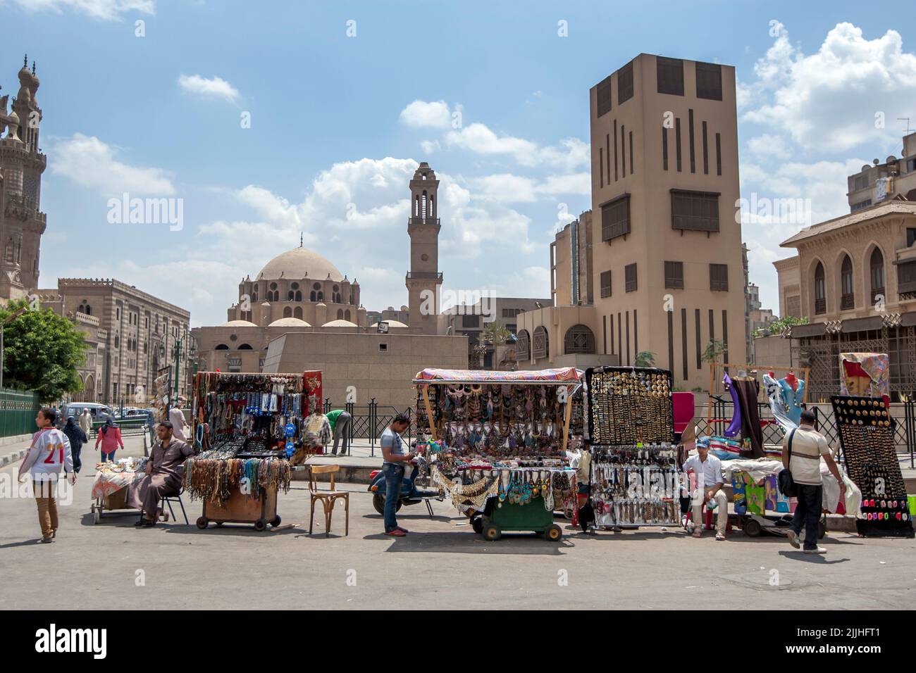 Souvenir sellers sit with their portable carts on a street adjacent to the Khan el-Khalili Bazaar at Cairo in Egypt. Stock Photo