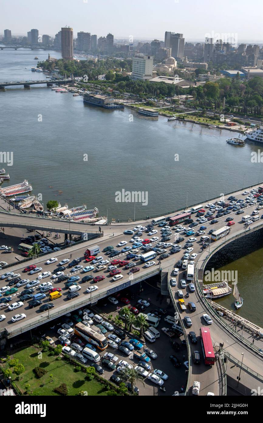Afternoon peak hour traffic gridlock over the 6th October Bridge which crosses the River Nile at Cairo in Egypt. Stock Photo