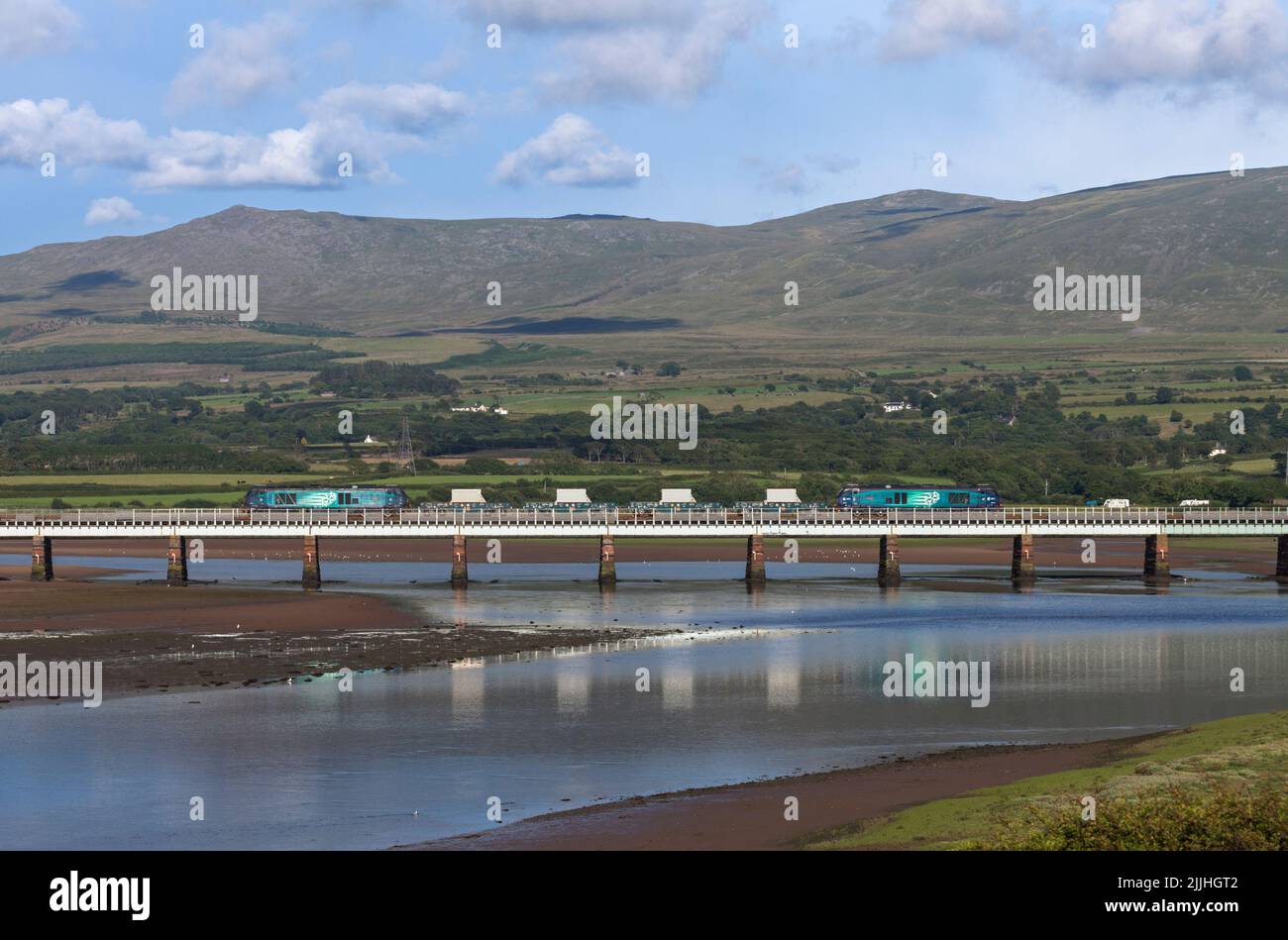 2 Direct Rail Services class 68 locomotives with a train of nuclear flasks on the scenic Cumbrian coast railway line crossing Eskmeals Viaduct Stock Photo