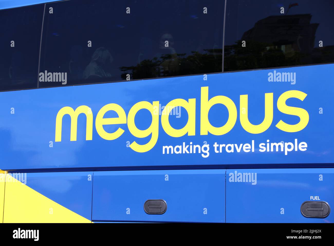 A CLOSE-UP VIEW OF FLEETNAME ON A MEGABUS COACH OF MEGABUS.COM Stock Photo