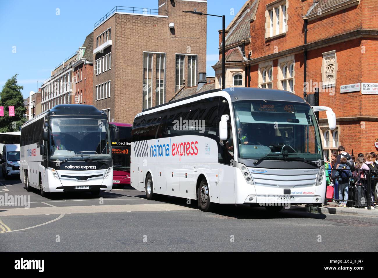 TWO NATIONAL EXPRESS COACHES IN LONDON Stock Photo