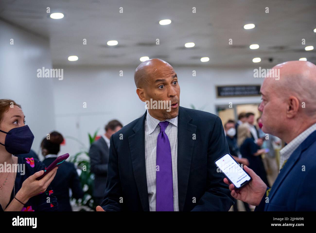 United States Senator Cory Booker (Democrat of New Jersey) talks with reporters as he makes her way through the Senate subway during a Senate vote on a motion to invoke cloture on the motion to concur in the House amendment, to the Senate amendment, to H.R.4346, the legislative vehicle for the CHIPS-Plus Act, at the US Capitol in Washington, DC, Tuesday, July 26, 2022. Credit: Rod Lamkey/CNP /MediaPunch Stock Photo