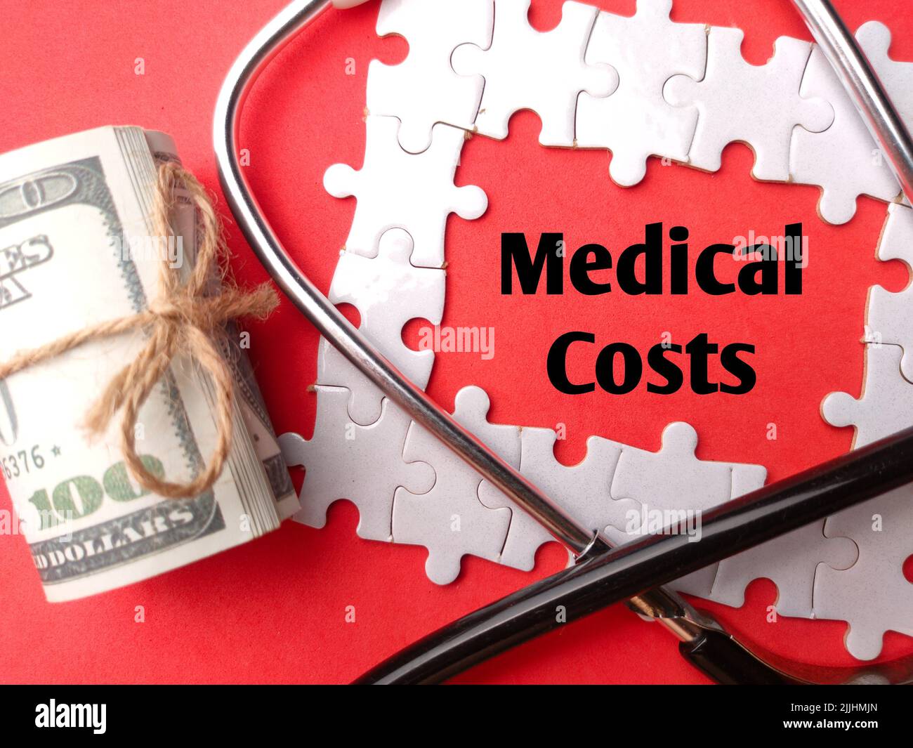 A stethoscope and banknotes with the word Medical Costs on a red