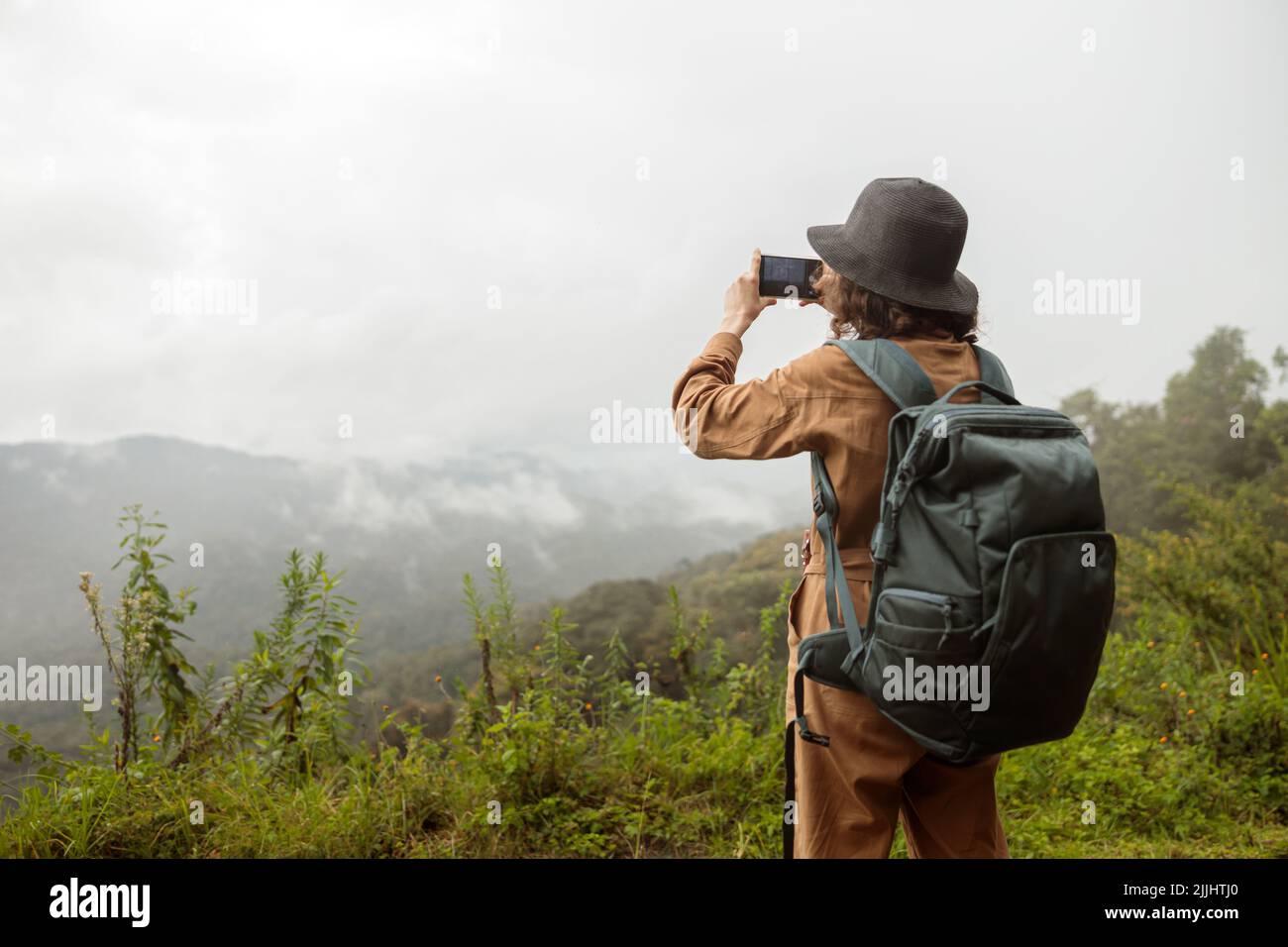 Back view female tourist stand hi-res stock photography and images - Alamy