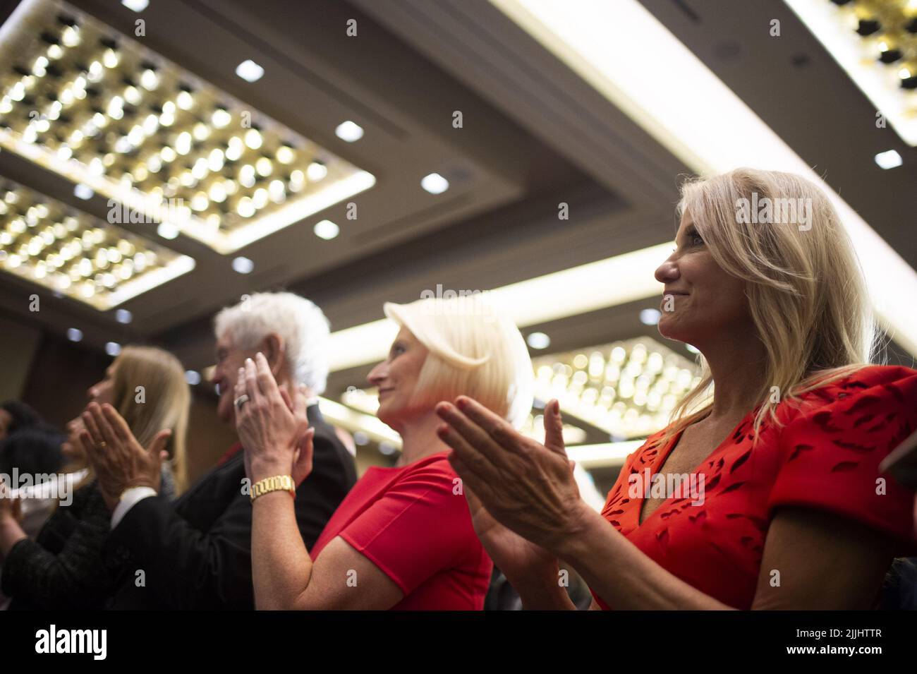 Washington, United States. 26th July, 2022. Former Speaker of the House Newt Gingrich, left, and Kellyanne Conaway, right, clap as Former President of the United States Donald Trump speaks during his first trip back to Washington, DC at the American First Agenda Summit held by the America First Policy Institute at the Marriott Marquis Hotel in Washington, DC on Tuesday, July 26, 2022. Photo by Bonnie Cash/UPI Credit: UPI/Alamy Live News Stock Photo