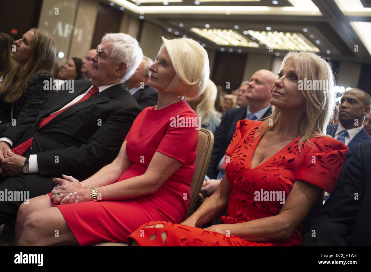 Washington, United States. 26th July, 2022. Former Speaker of the House Newt Gingrich, left, and Kellyanne Conaway, right, look on as Former President of the United States Donald Trump speaks during his first trip back to Washington, DC at the American First Agenda Summit held by the America First Policy Institute at the Marriott Marquis Hotel in Washington, DC on Tuesday, July 26, 2022. Photo by Bonnie Cash/UPI Credit: UPI/Alamy Live News Stock Photo