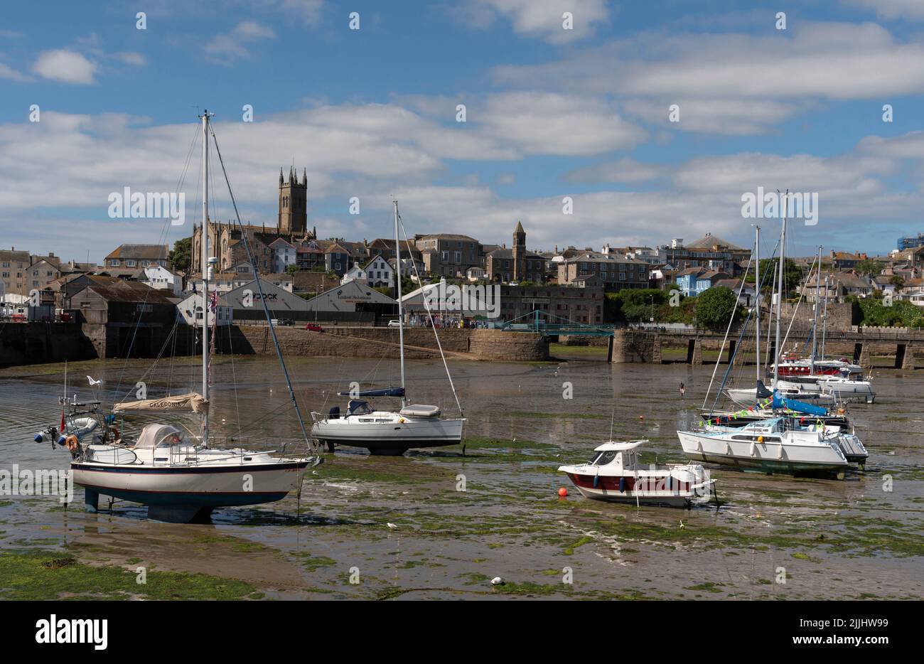 Penzance, Cornwall, England, UK. 2022. Penzance Harbour with boats settled on the mud with a backdrop of the town centre. Cornwall UK. Stock Photo