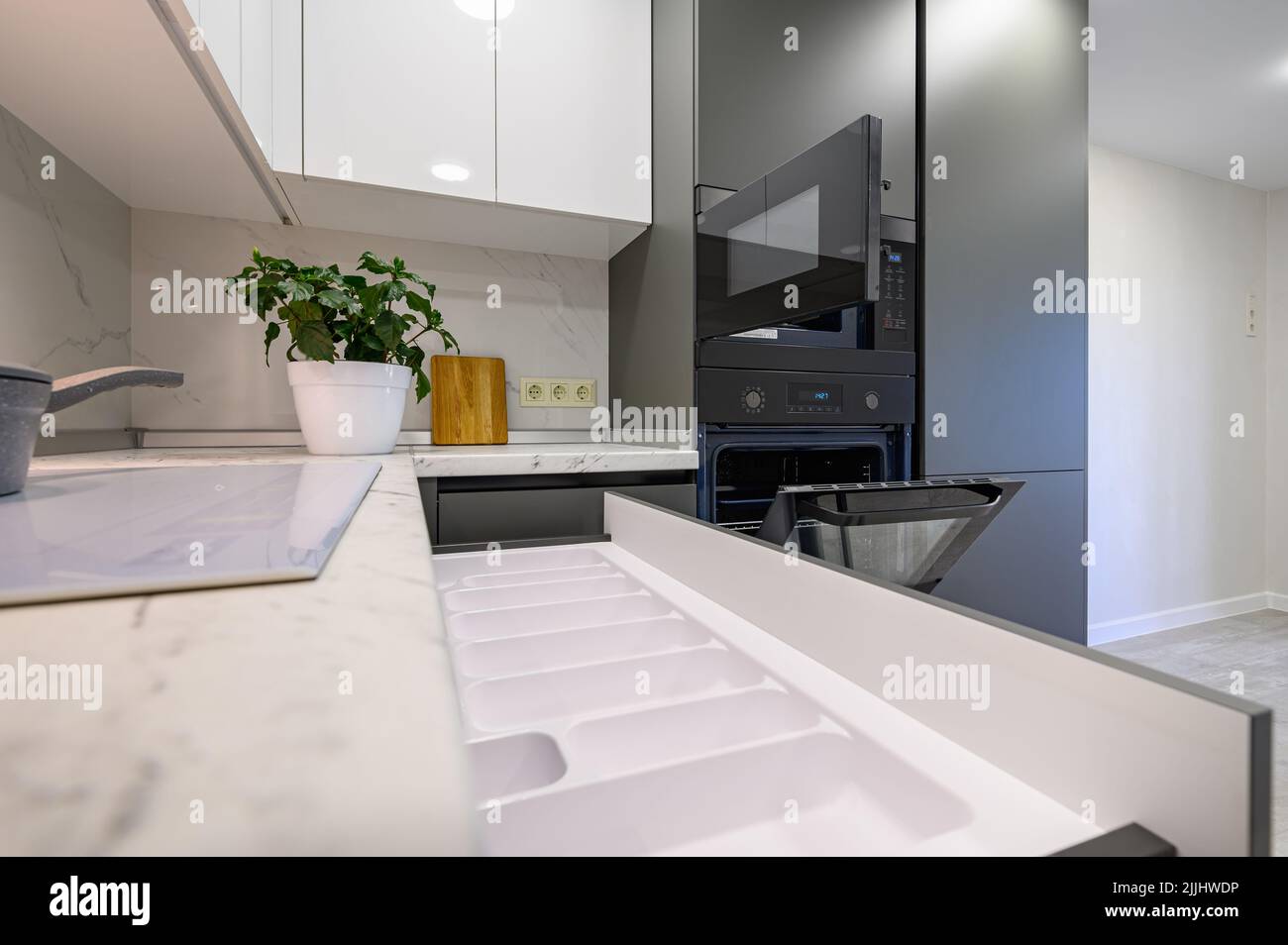 Marble worktop of modern white and dark grey kitchen Stock Photo Alamy
